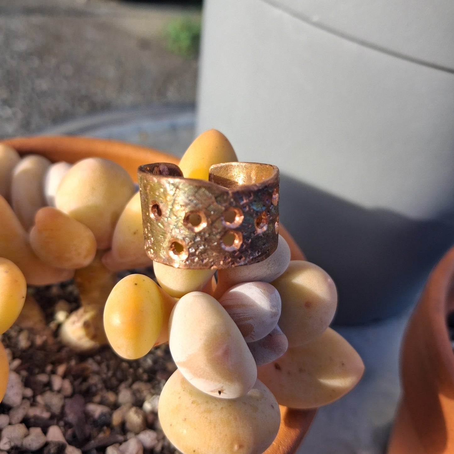 Wide copper cuff with intentional craters