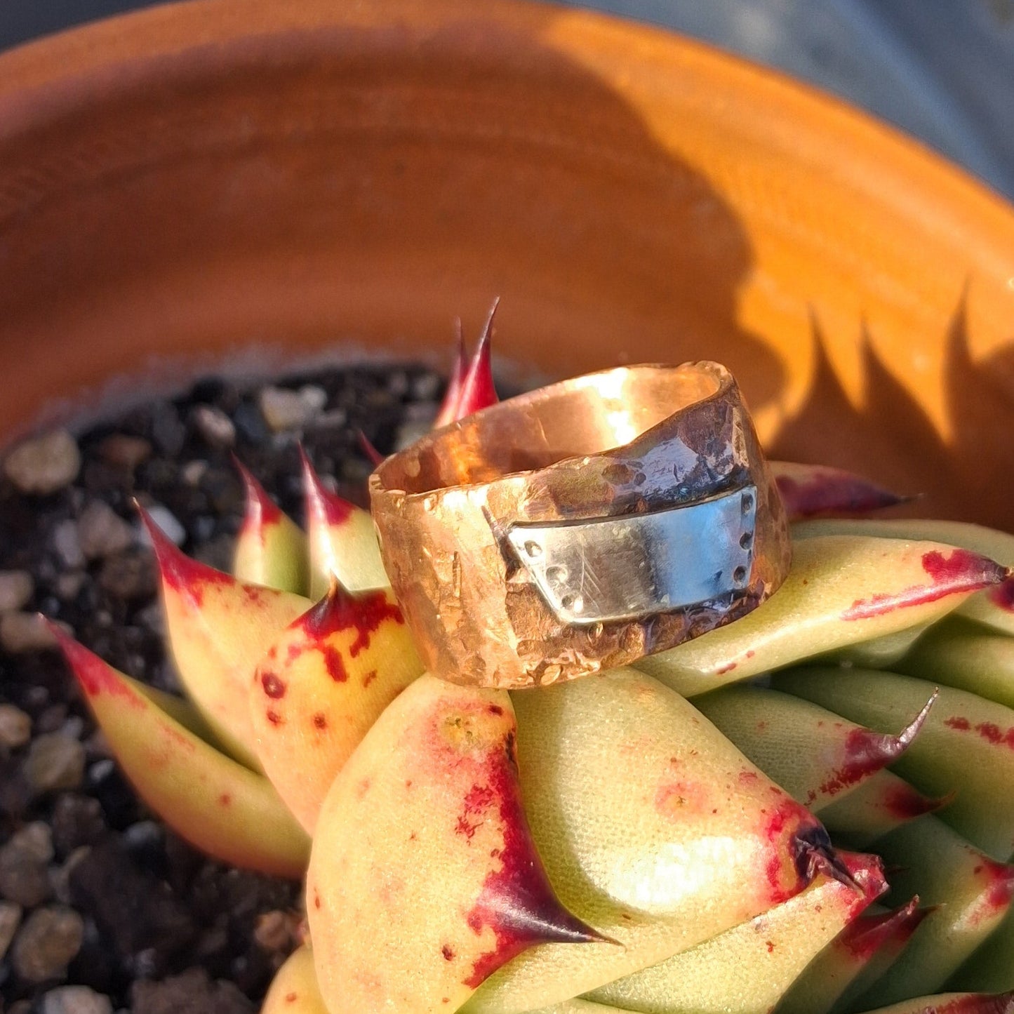 Textured copper band with dimpled sterling silver tablet