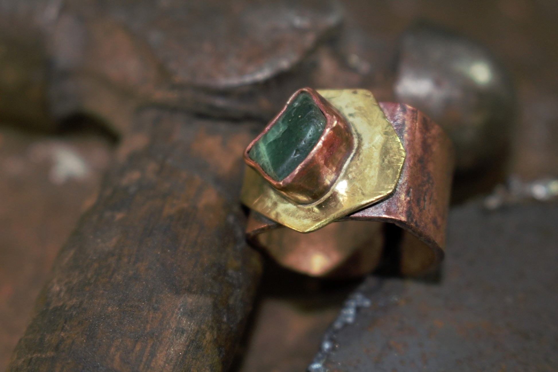 Raw emerald and copper with brass ring