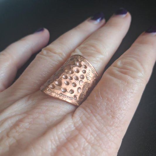 Heavily textured copper ring with architectural spine 